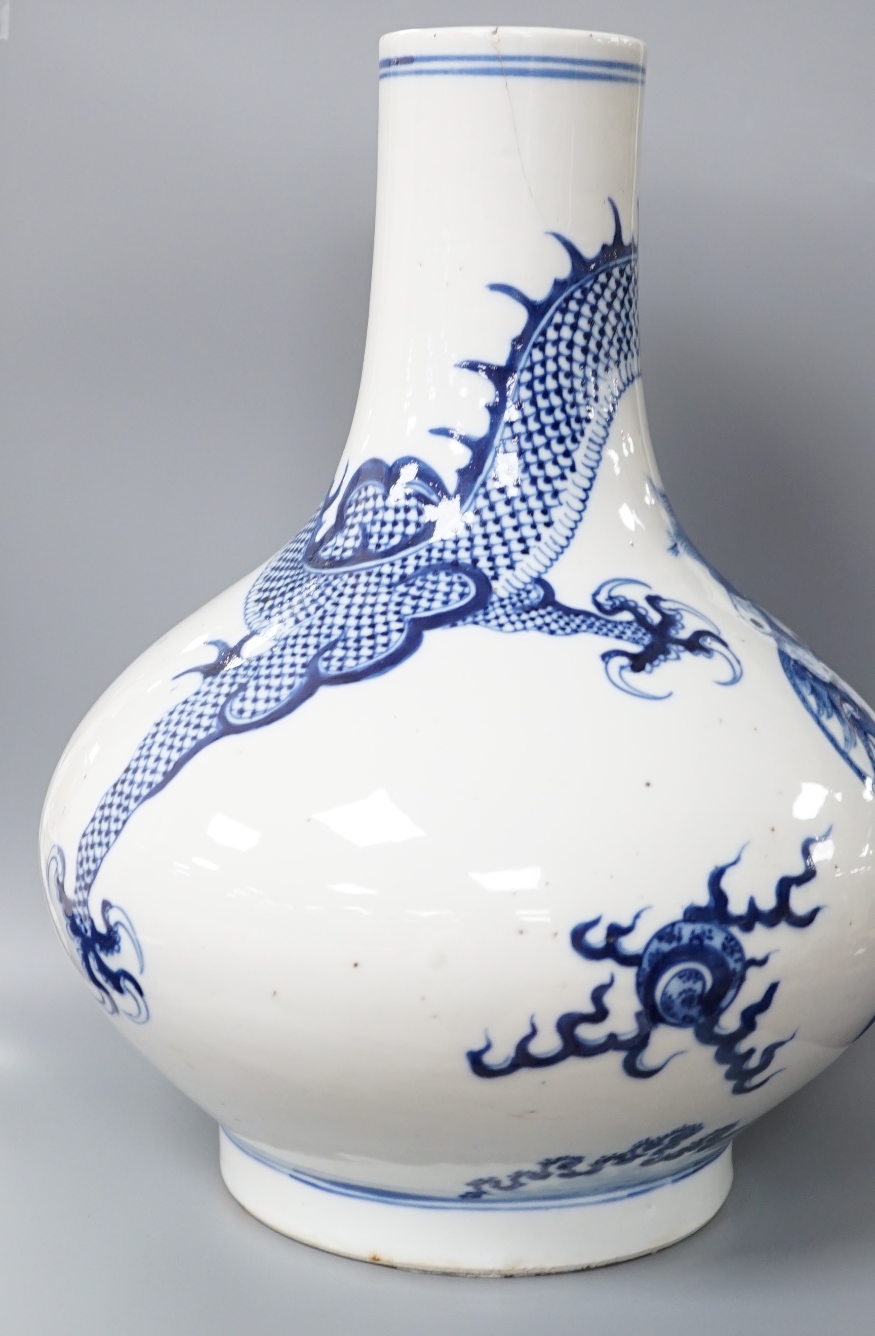 A Chinese blue and white ‘dragon’ bottle vase 32cm